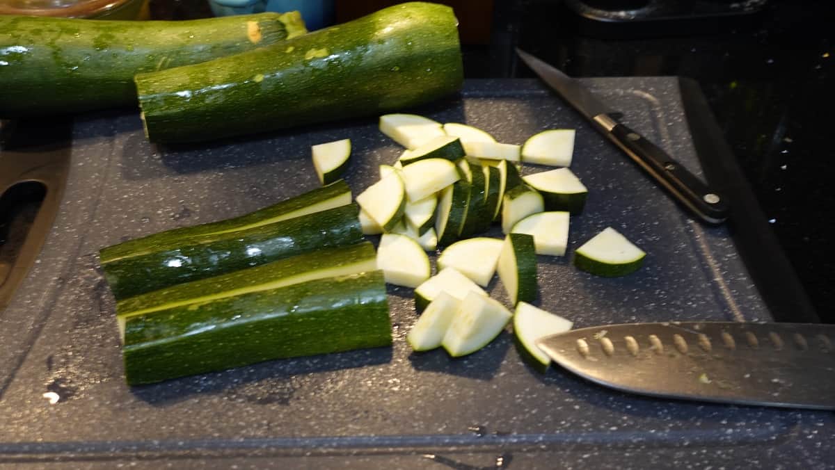 Chopped zucchini on a cutting board.