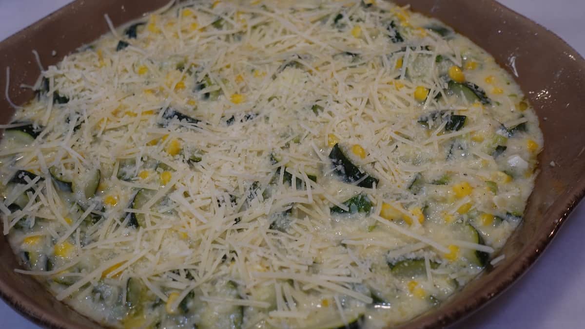 Cheese spread over the top of a vegetable gratin.