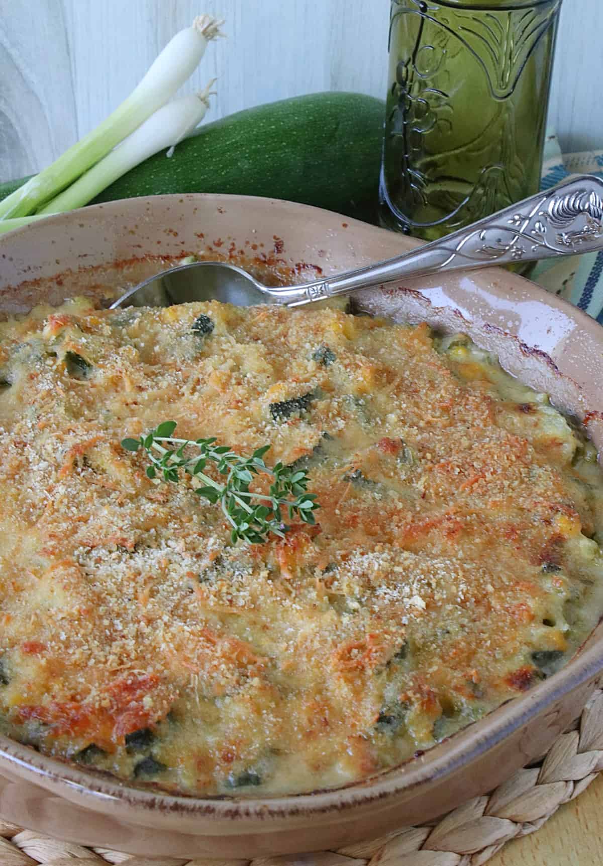 A baked Zucchini Corn Gratin with a golden cheese and breadcrumb topping. 