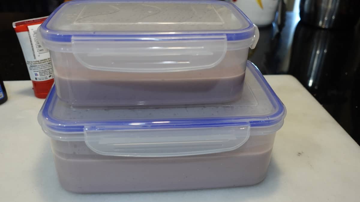 Two containers of gelato base ready for the refrigerator. 