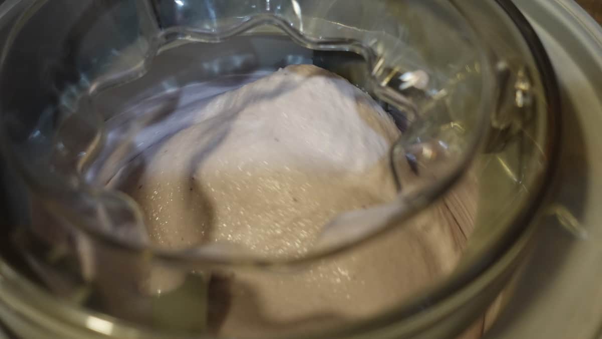 An ice cream maker churning berry gelato.