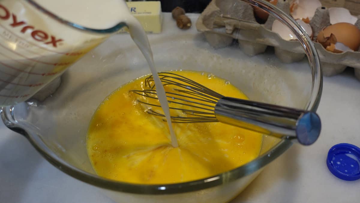 Milk being added to whipped eggs.