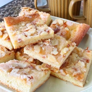 Squares of German Zuckerkuchen on a serving platter.