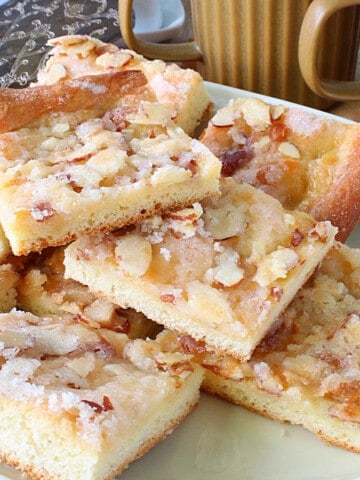 Squares of German Zuckerkuchen on a serving platter.