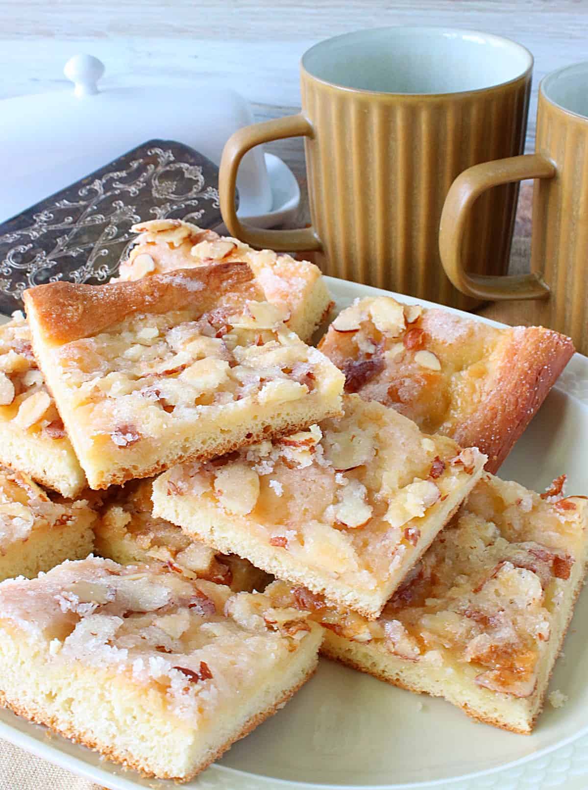 Squares of German Zuckerkuchen on a serving platter.