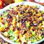 A super colorful Fall Chopped Salad with cranberries, Brussels sprouts, pears, and bacon.