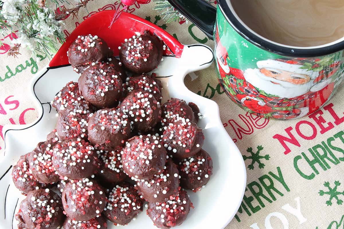 A cute Santa plate filled with Chocolate Peppermint Coffee Drops with red and white sugar.