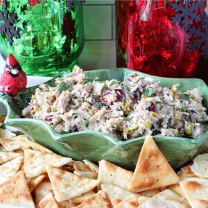 A colorful red and green Christmas Chicken Salad in a festive holiday bowl.