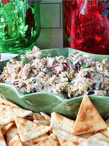 A colorful red and green Christmas Chicken Salad in a festive holiday bowl.