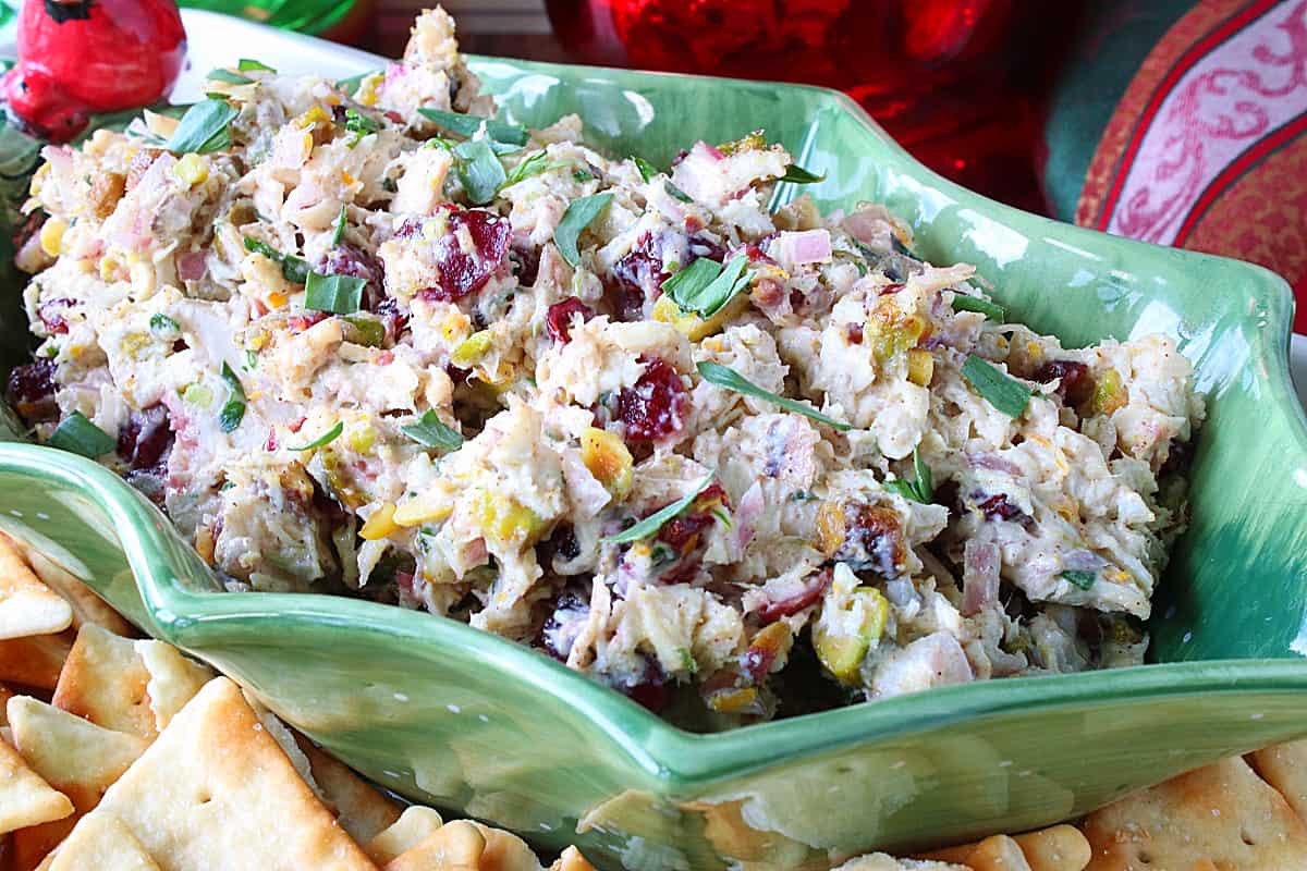 A green holly berry bowl filled with Christmas Chicken Salad.