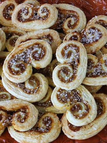 A plie of Pumpkin Spice Palmiers with sanding sugar on top.