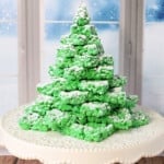 A pretty green Rice Krispies Christmas Tree with confectioners' sugar snow.