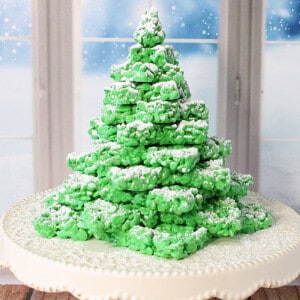 A pretty green Rice Krispies Christmas Tree with confectioners' sugar snow.