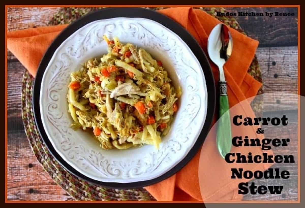 An orange napkin, green spoon, and a bowl of Carrot Ginger Chicken Noodle Stew.