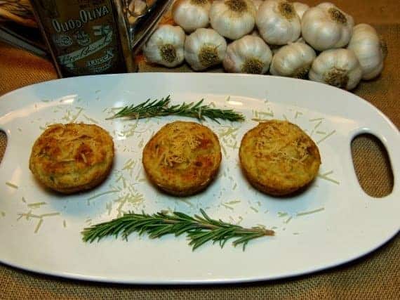 Three Focaccia Muffins on a white oval plate.