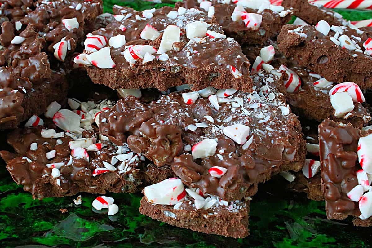Delicious milk chocolate Cocoa Krispies Peppermint Bark on a green glass plate.