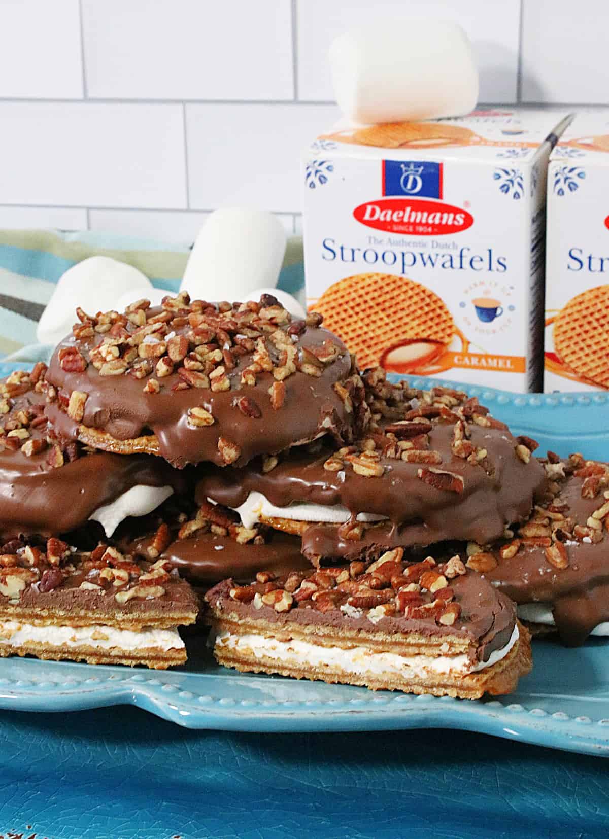 A blue plate filled with S'mores Stroopwafel Sandwiches.