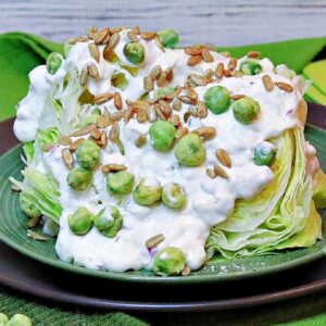 A green Wedge Salad with Wasabi Peas and Blue Cheese Dressing.
