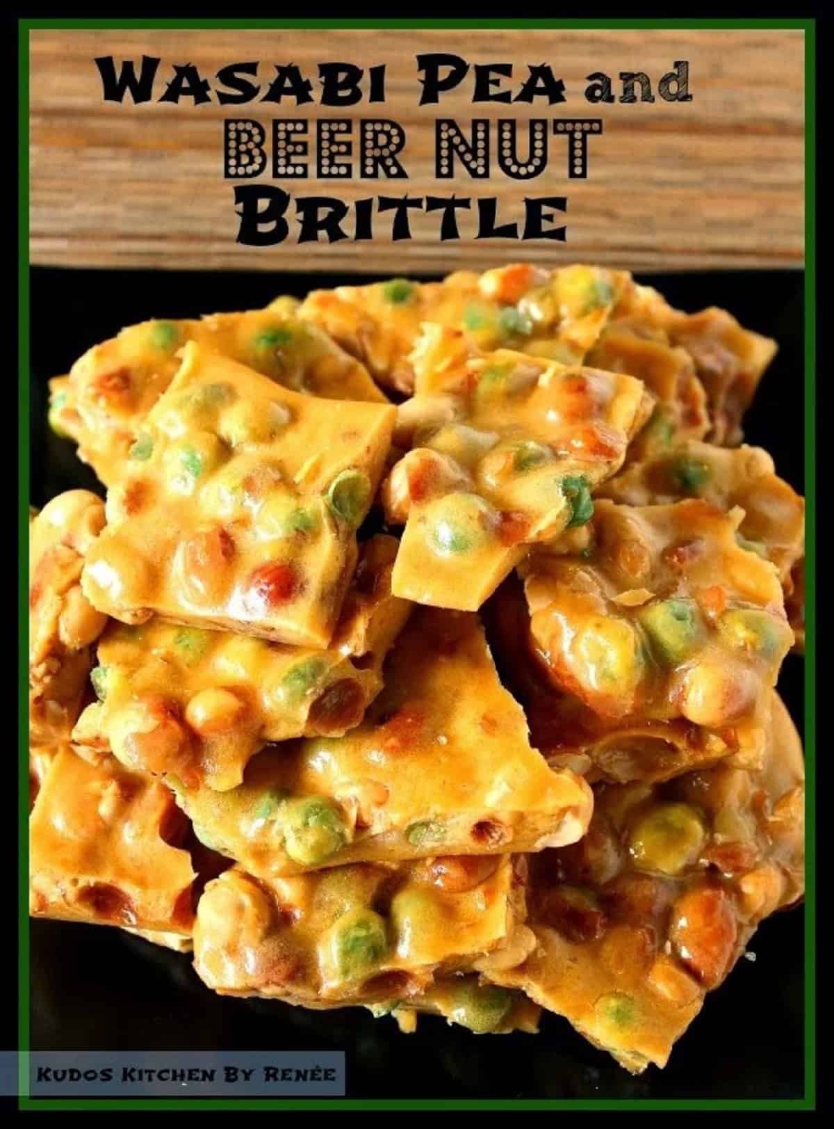 A stack of golden-brown Wasabi Pea and Beer Nut Brittle on a black square plate. 