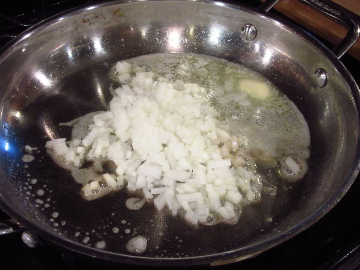 Melted butter and onions in a skillet.