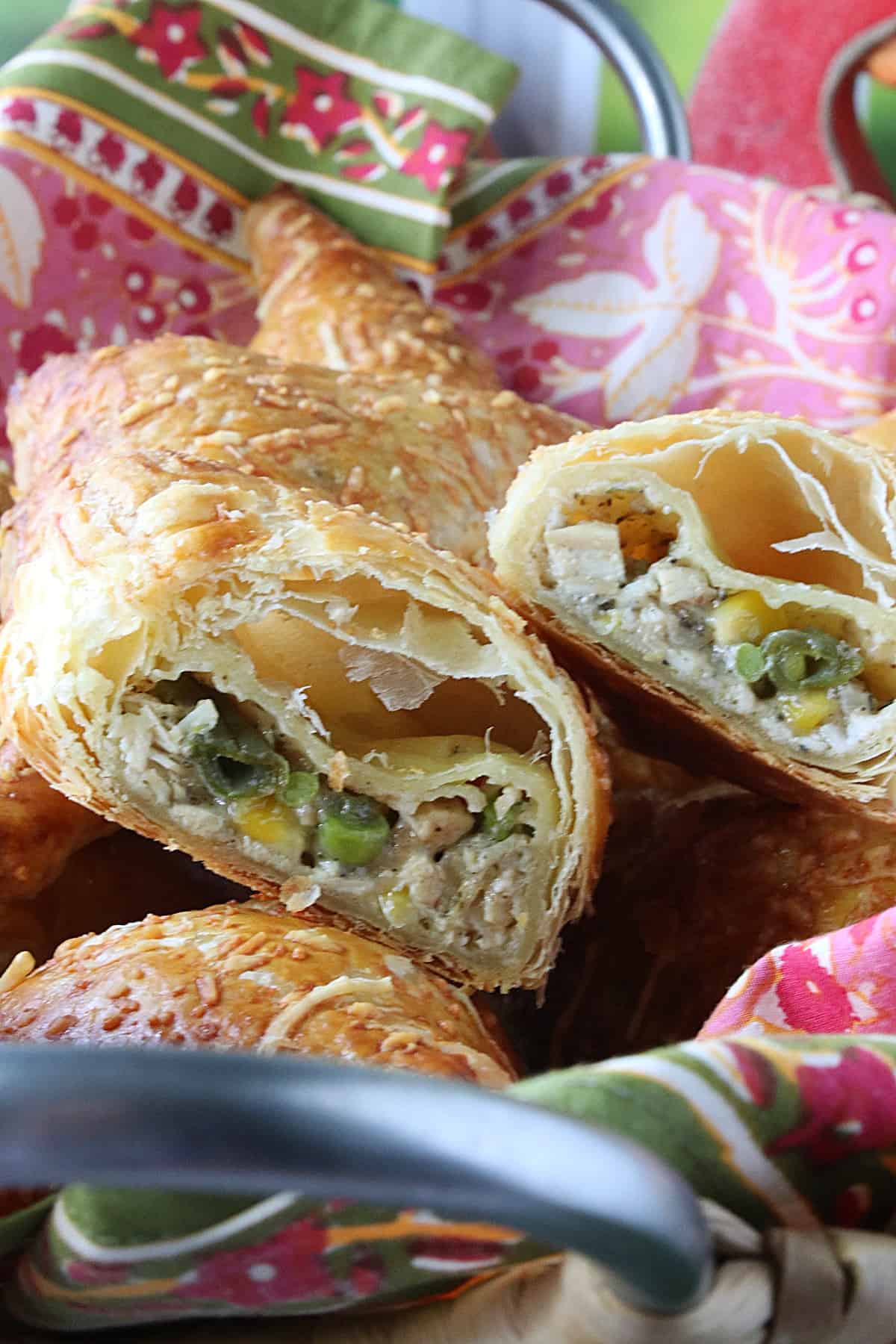 The inside of a Chicken Pot Pie Turnover with a colorful napkin in the background.