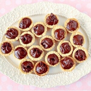 A platter of Nutella Cookie Cups on a pretty oval serving dish.