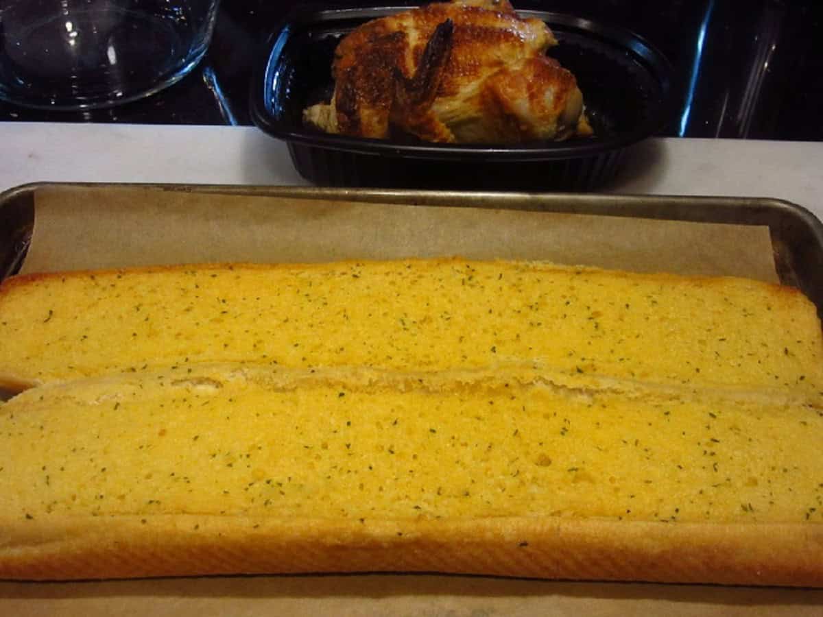 Baked garlic bread on a baking sheet.
