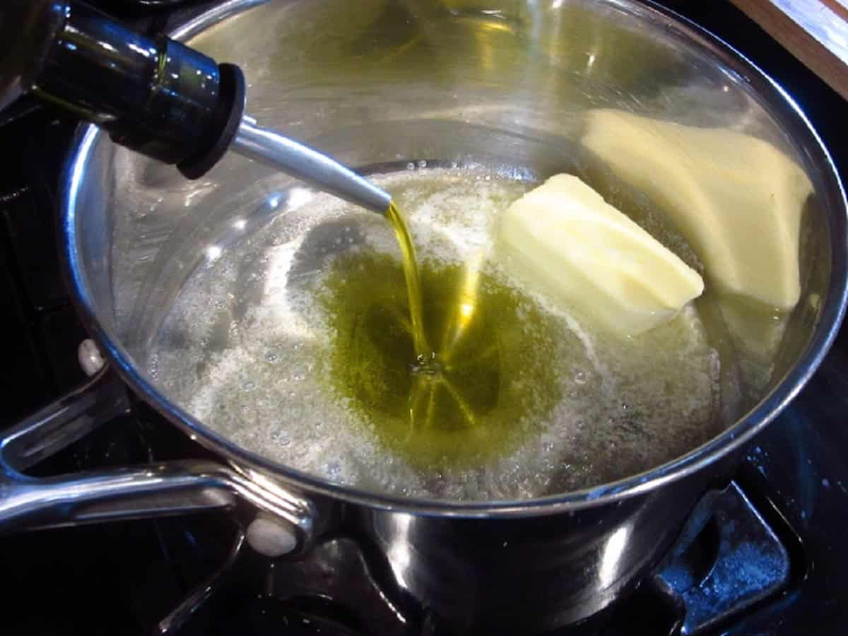 Oil and butter melting in a saucepan.