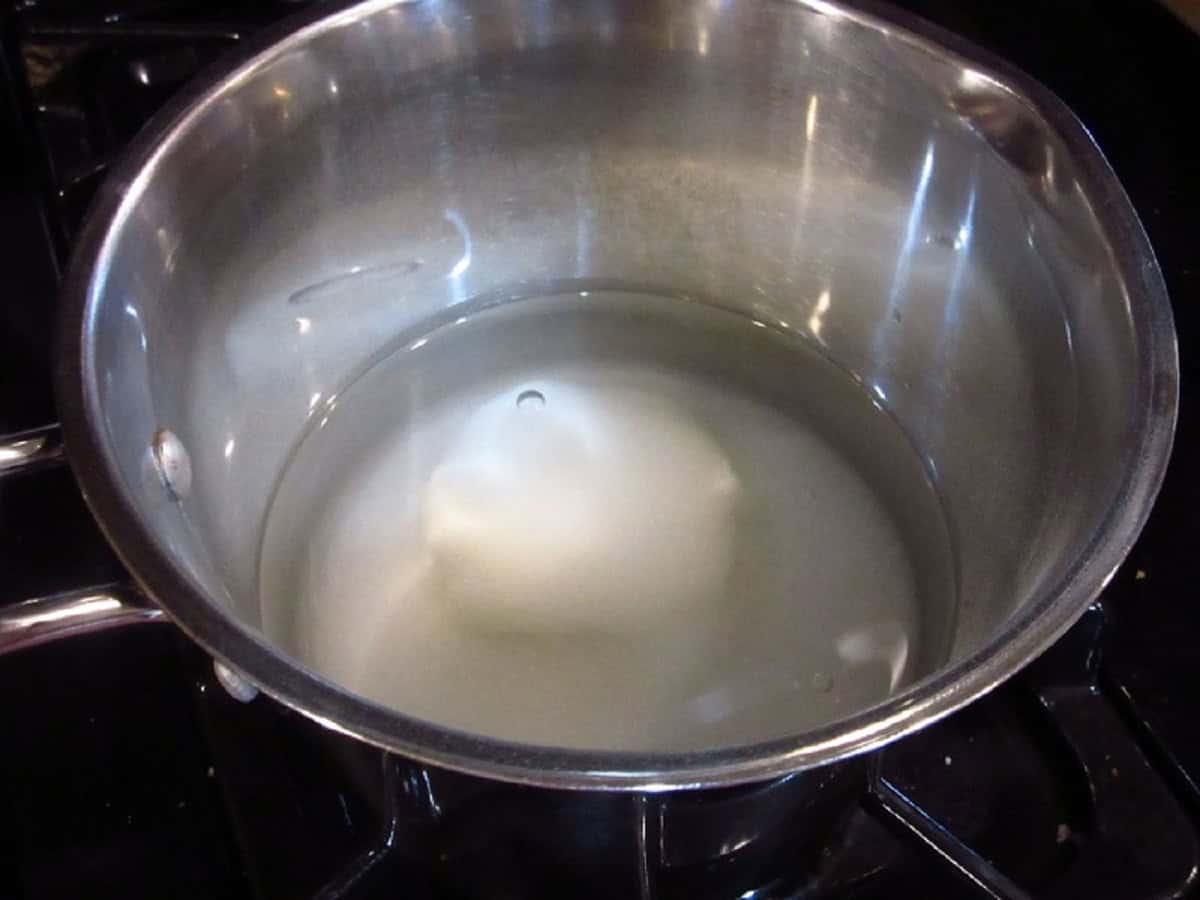Water and monk fruit sweetener in a saucepot.