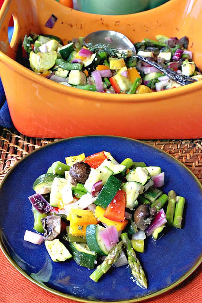A blue plate and an orange casserole dish both filled with Summertime's Roasted Rainbow Vegetables.