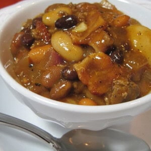A small white bowl filled with Calico Beans.