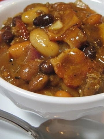 A small white bowl filled with Calico Beans.