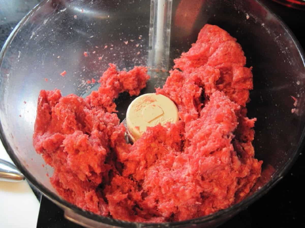 Ground beef short ribs in a food processor.