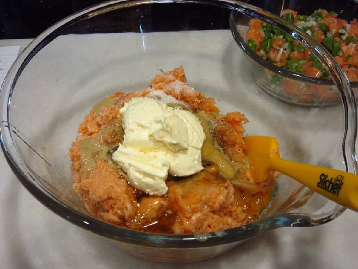 Ingredients in a glass bowl to make salmon patties.