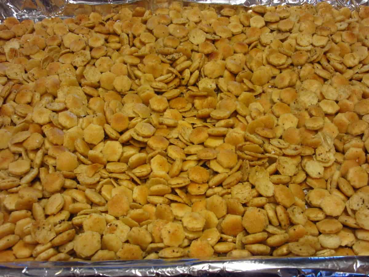 Baked everything seasoned oyster crackers on a baking sheet.