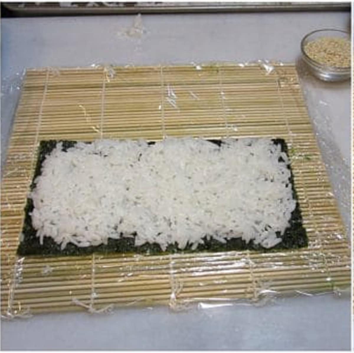 Rice and a nori sheet for making sushi.