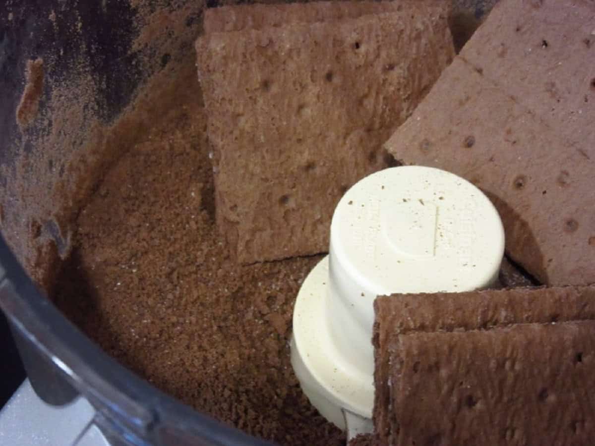 Chocolate graham crackers in a food processor.