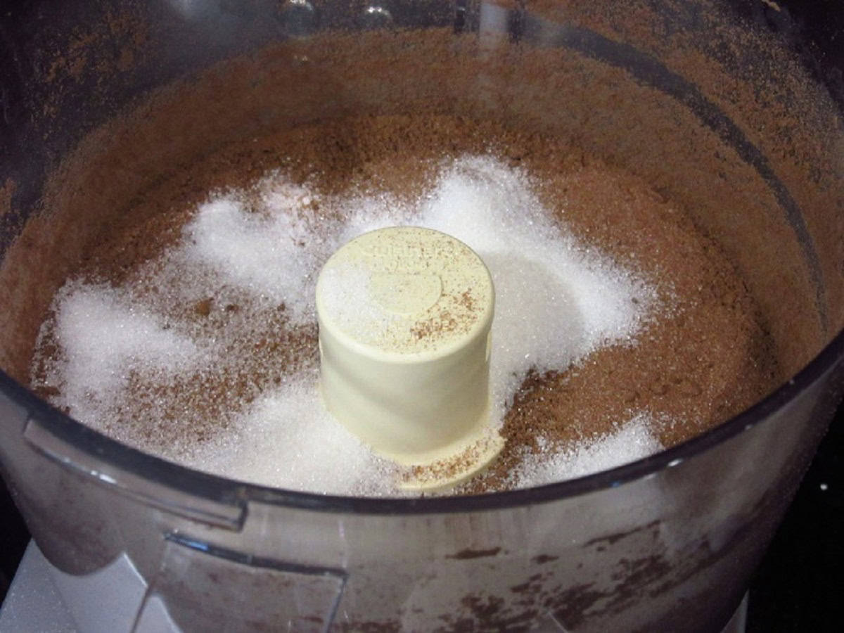 Graham cracker crumbs and sugar in a food processor.