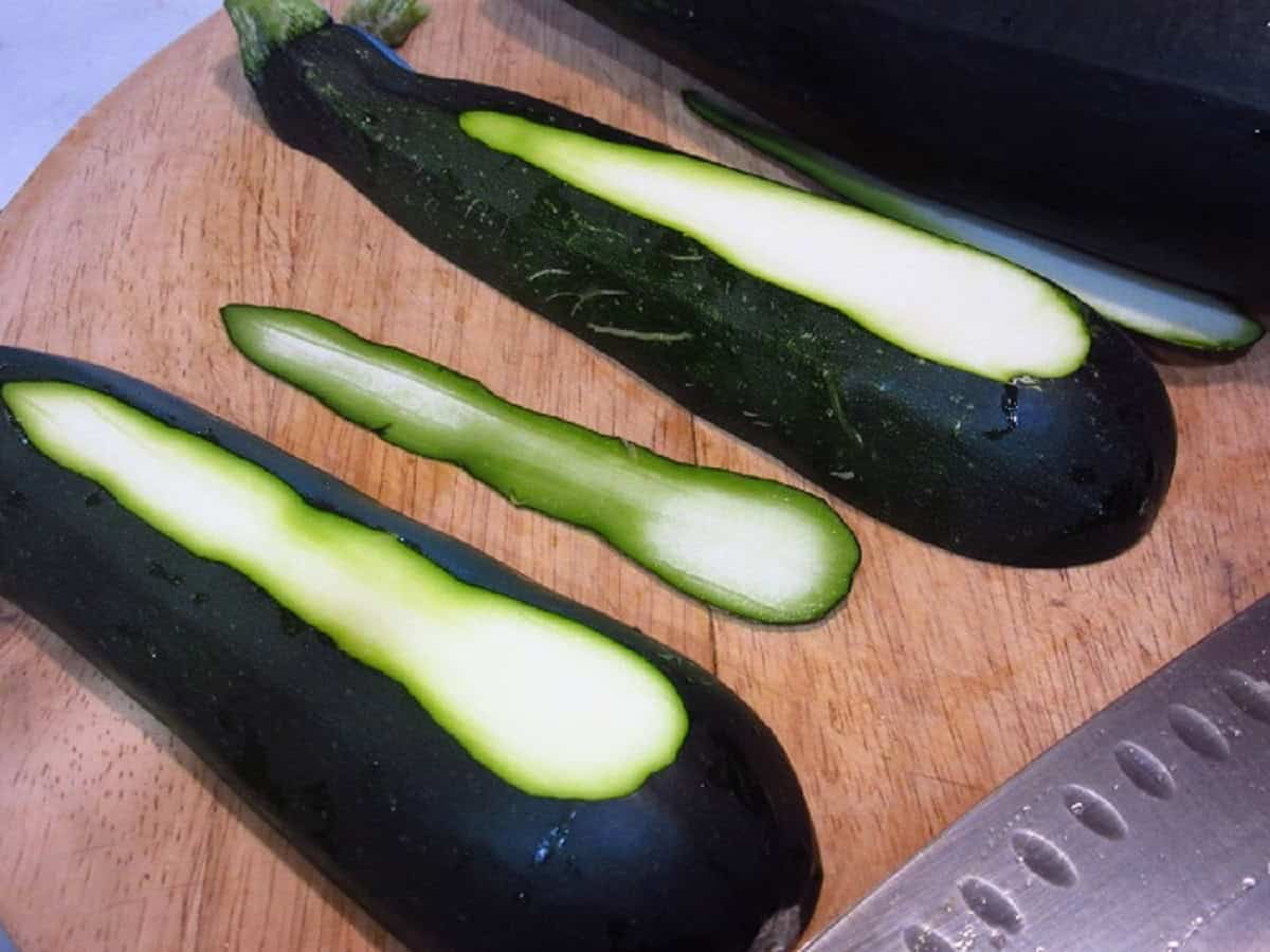 A small slice taken from the bottom of a zucchini so it sits straight.