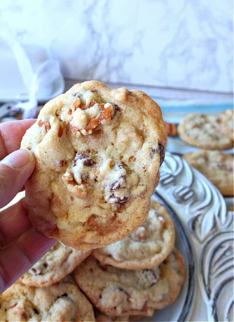 A hand holding a Take 5 Cookie.