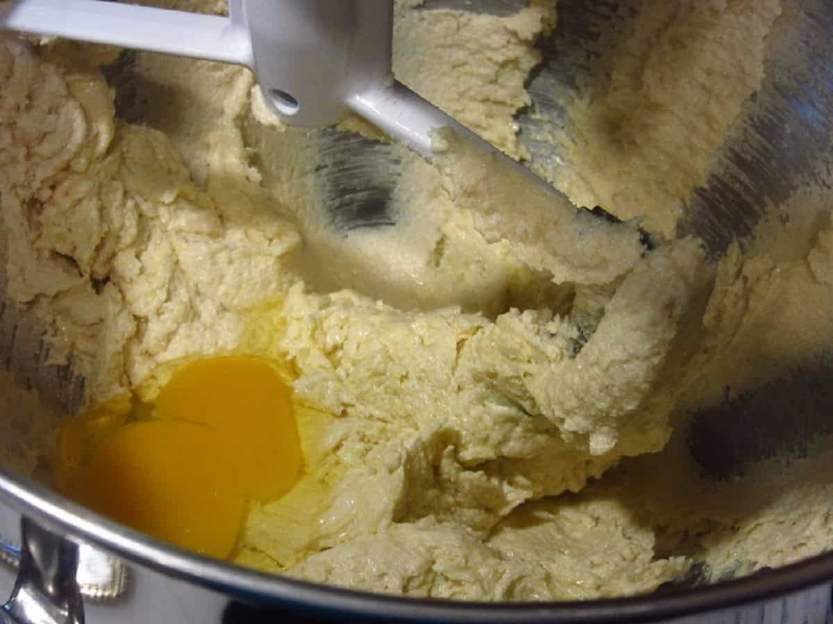 Eggs in a cookie batter stand mixer bowl.