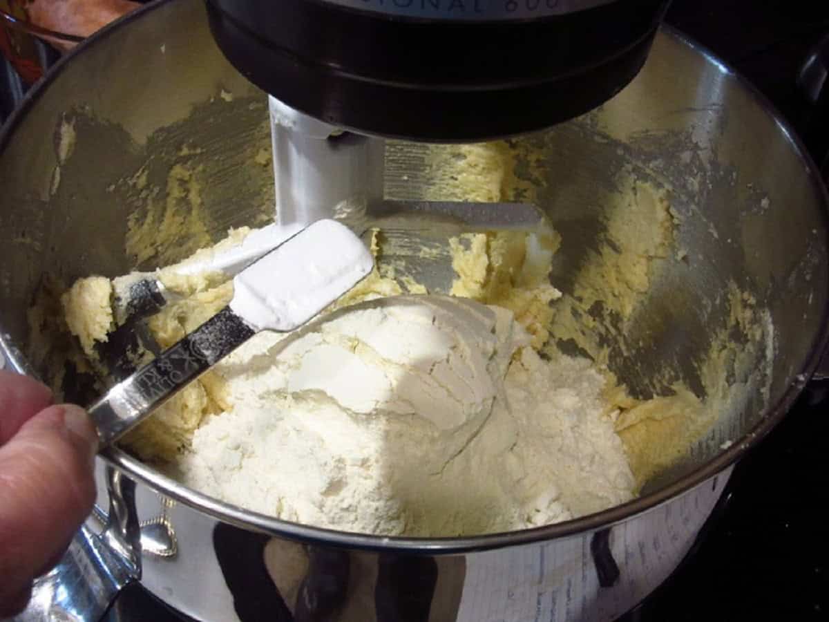 Baking soda being added to a cookie dough batter.