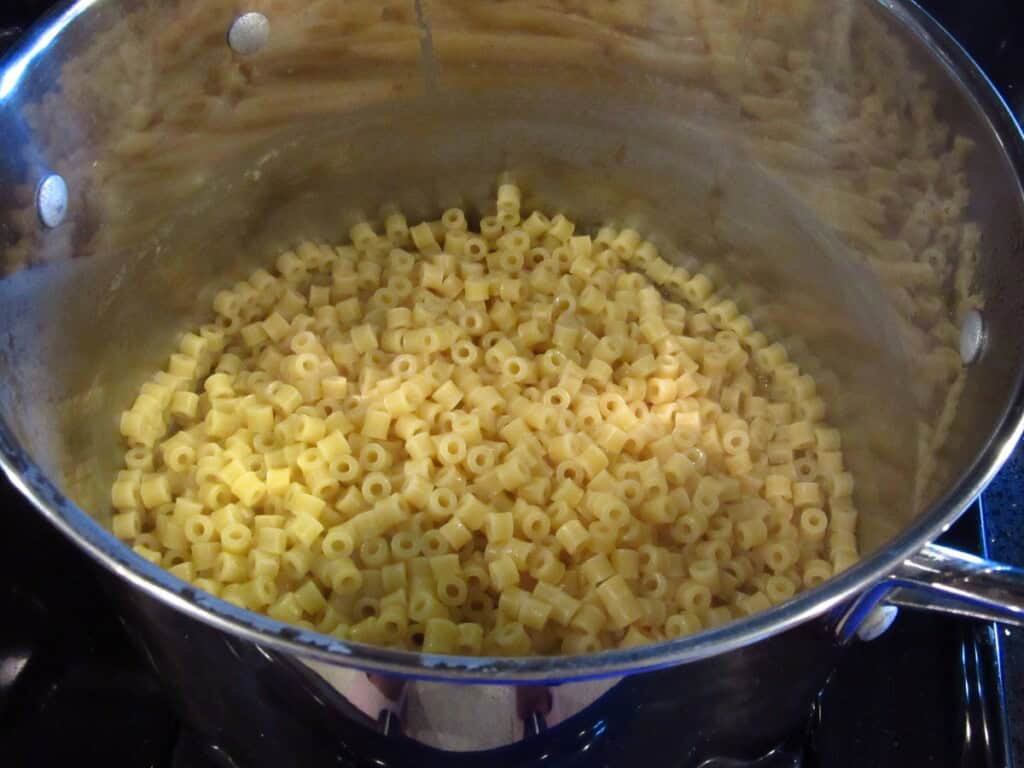 Drained ditallini pasta in a large pasta pot.