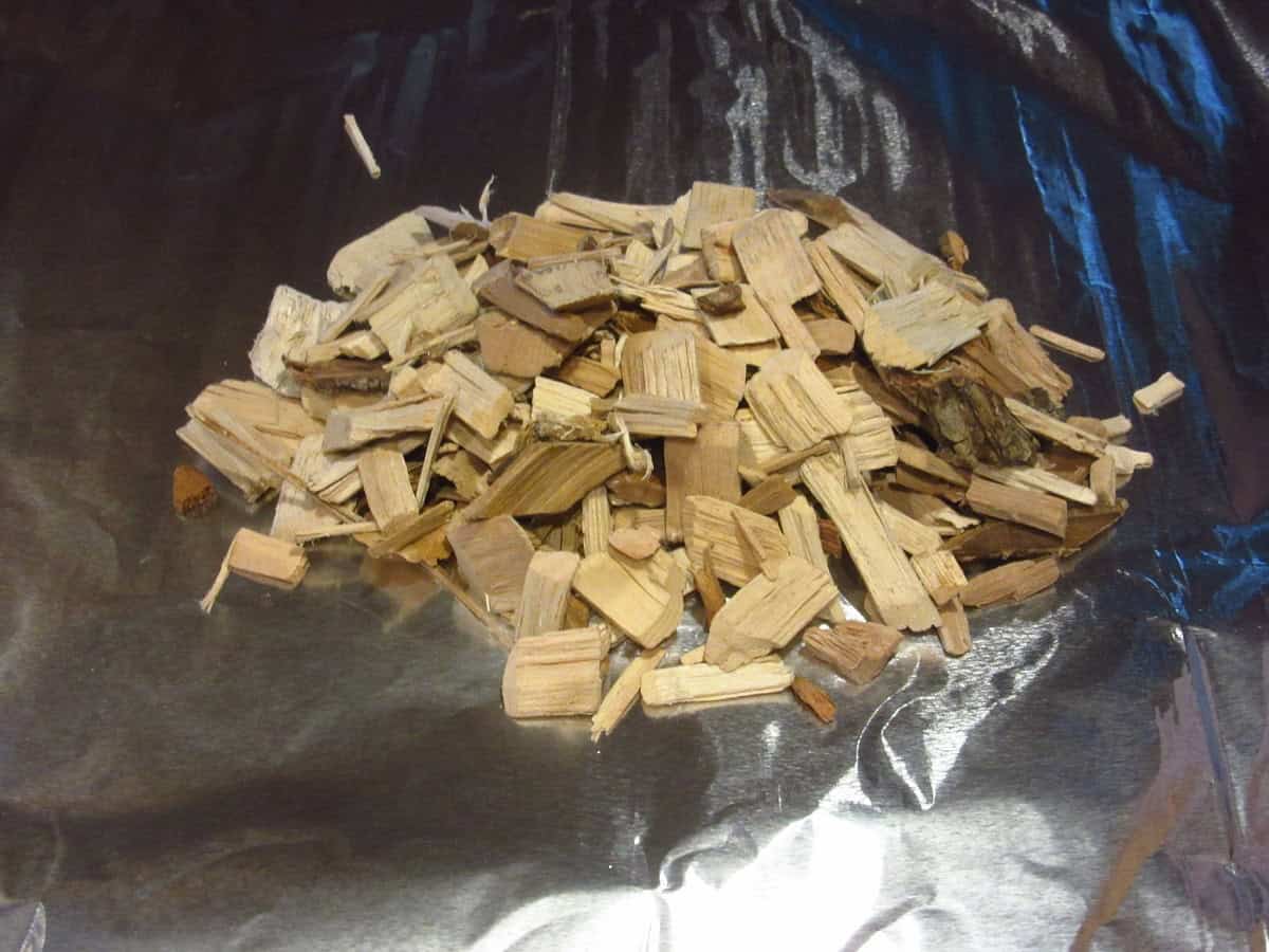 Dry wood chips on a sheet of foil to turn an outdoor grill into an smoker.