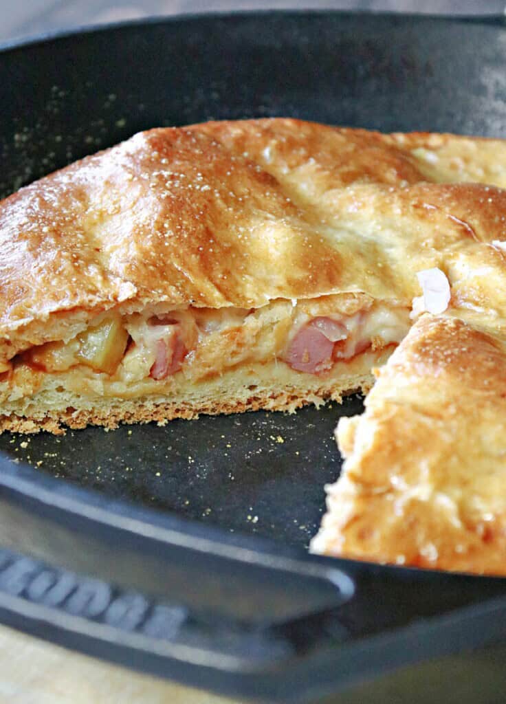 The inside of a Hawaiian stuffed pizza.