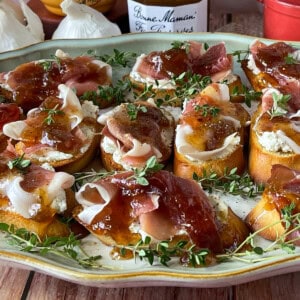 Fig jam and honey on goat cheese and prosciutto crostini.