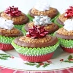 Festive looking Gingerbread Pecan Pie Tarts in red and green cupcake liners for Christmas.