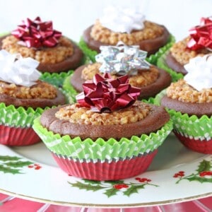 Festive looking Gingerbread Pecan Pie Tarts in red and green cupcake liners for Christmas.