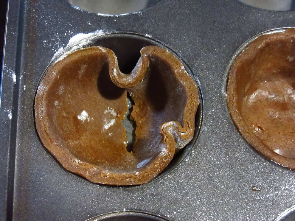 A rip in gingerbread pie crust.