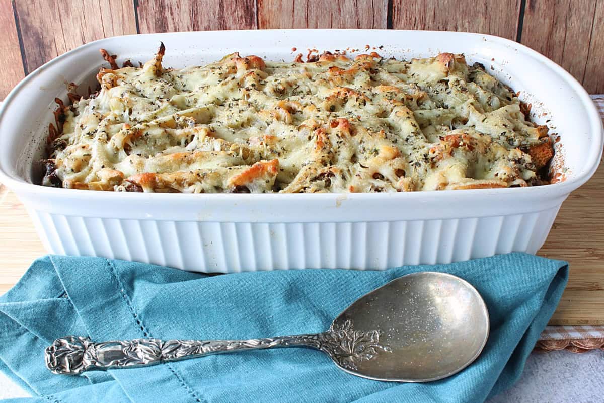 A white rectangle casserole dish filled with Italian Beef Bread Pudding.